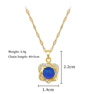 Detailed view of heart pendant with blue stone and cubic zirconia featuring size dimensions