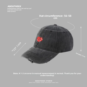 Close-up of red heart embroidery on grey washed cotton baseball cap with size specs