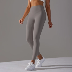 Detailed side view of high-waisted grey yoga leggings highlighting peach lift and fit