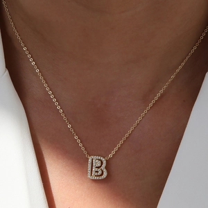 Gold 18k plated necklace featuring a cubic zirconia inlaid letter B pendant on model