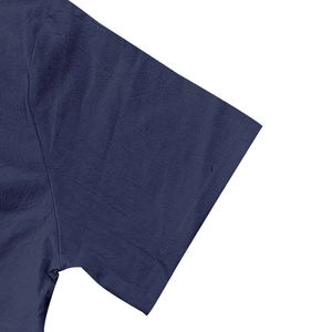 Detailed close-up showing the stitching and linen texture of the dark blue short sleeve cuff
