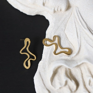 Artistic gold irregular wave stud earrings with polished metallic texture and fluid lines