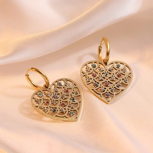 Retro gold plated heart earrings with colorful zircon stones on champagne satin fabric