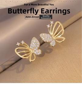Detailed macro view of butterfly earrings featuring high-quality AAA cubic zirconia in gold