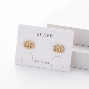 Macro detail of S925 sterling silver gold earrings with micro-pave white zircon crystals