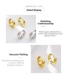 Detailed view of polished gold and silver hoop earrings with secure click-top closure