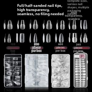 Macro shot of matte finish clear ballet T-shape press-on nail tips in diverse box sizes