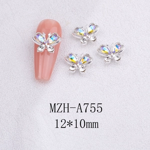 Macro view of 3D silver alloy butterfly nail charms with AB rhinestones and size details