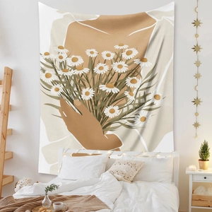 Detail of bohemian tapestry featuring daisy bouquet illustration on a bedroom wall