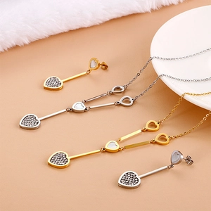 Elegant heart pendant necklace and drop earrings set with crystals in gold and silver finish