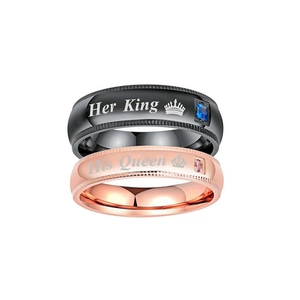 Close-up of Her King His Queen couple rings in black and rose gold with zircon