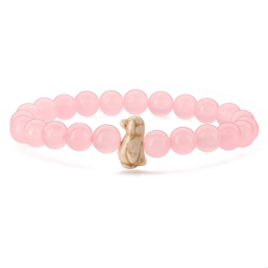 Pink crystal elastic bracelet with a bird pendant charm against a white background