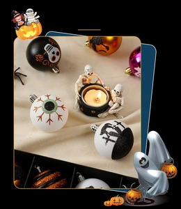 Detailed view of Halloween hanging ornaments with ghost, skull and cross patterns