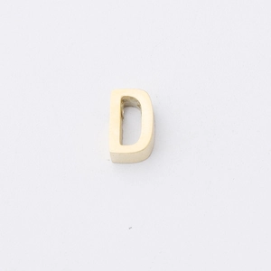 Detailed view of polished gold stainless steel letter D charm bead with a small hole