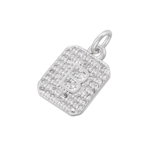 Close-up of a silver rectangular pendant featuring a sparkling zircon-encrusted letter B