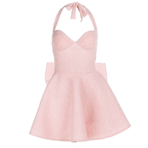 Detail of pink sequin halter dress showing the back bow and tweed texture