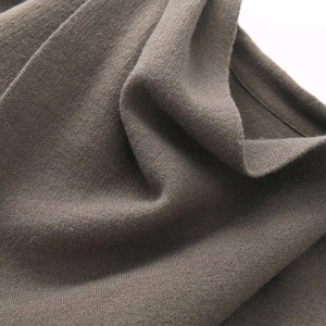 Dark coffee asymmetrical knit shawl with vertical ribbed texture and soft drape