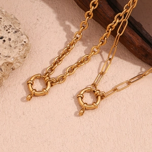 Detail of 18K gold-plated stainless steel paperclip and O-link chain necklaces with spring clasps