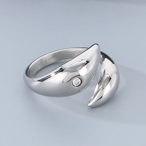 Detail showing polished stainless steel open ring with a small zircon stone accent