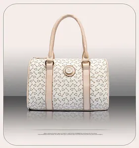Front view of beige Boston bag with brown anchor pattern and golden circular metal logo