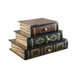 European vintage book-shaped storage drawer set with gold floral patterns and metal handles