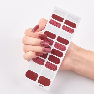 Close-up of model holding wine red and leopard print self-adhesive nail polish stickers