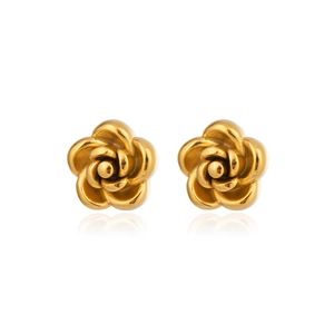 Macro shot of elegant golden rose stud earrings in polished stainless steel finish