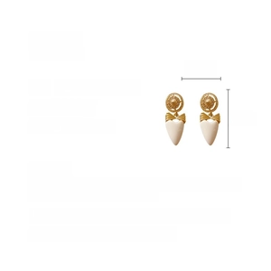 Detailed view of vintage heart drop earrings featuring rhinestones and white acrylic charms