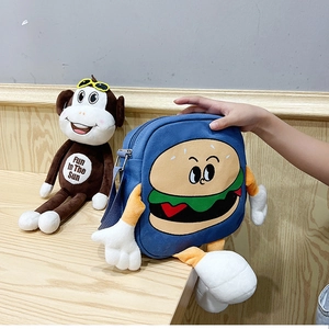 Detail of blue canvas cartoon burger bag with plush 3D hands and feet decorations