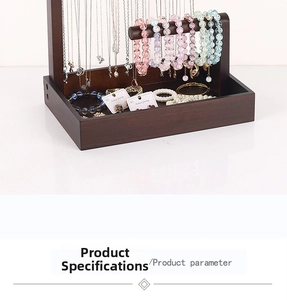 Detail of solid wood jewelry stand with hanging bar and walnut finish storage tray