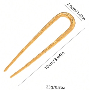 U-shaped gold metal hair pin with wavy texture and dimensions 10cm x 2.6cm