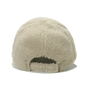 Detail view of the beige sherpa fleece baseball cap featuring an adjustable back strap