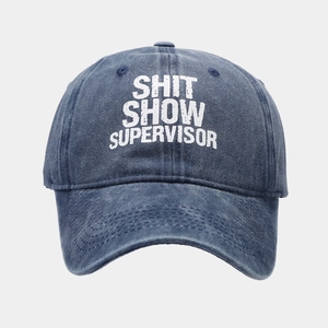 Detail of navy washed cotton baseball cap featuring Shit Show Supervisor print