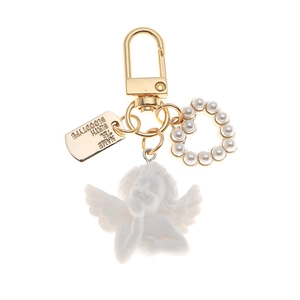 Baroque angel keychain with pearl heart and gold personalized metal plate on white back