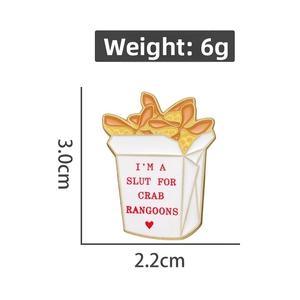 Macro shot of crab rangoon take-out box enamel pin with size and weight dimensions