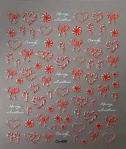 Macro shot of 3D embossed Christmas nail stickers with candy canes and bows