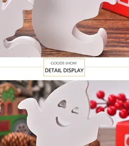 Detailed view of matte white wooden ghost figurines with hollow eyes for Halloween decor