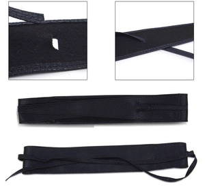 Detailed view of a black wide wrap-around PU leather corset belt with tie closure