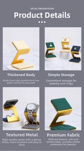 Detail view of gold Z-shaped jewelry display stand with microfiber lining and metal base