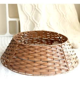 Brown woven Christmas tree collar with a durable metal frame for rustic holiday decor