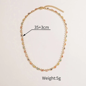 Macro detail of multicolored enamel heart links and gold chain with dimensions
