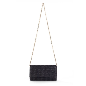 Detailed view of black woven texture and gold chain strap on the rectangular clutch bag