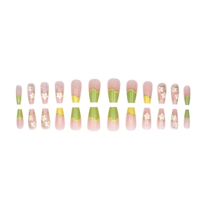 Fresh floral press-on nails with daisy patterns in pastel yellow and green wavy tips