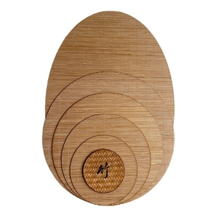 Bamboo tea mat set featuring oval and round heat-resistant coasters in natural wood finish