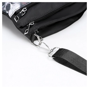 Detail of gothic skull print crossbody bag featuring durable nylon and silver metal zippers