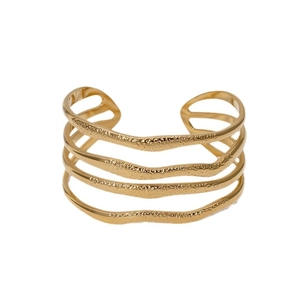 Exaggerated wide gold-plated stainless steel cuff bracelet with layered wave textures