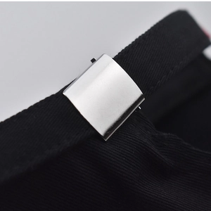 Detail of adjustable metal silver buckle on black cotton baseball cap strap