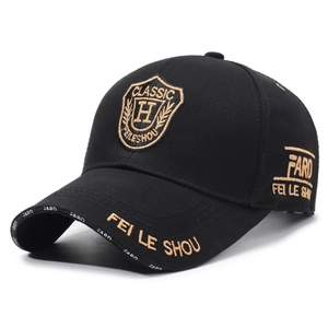 Classic black cotton baseball cap with gold shield embroidery and lettering details