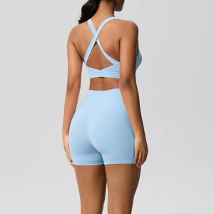 Rear view of light blue yoga set with cross-back sports bra and high-waisted gym shorts