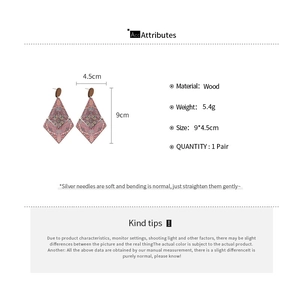 Detail showing dimensions of 9x4.5cm for these ethnic wood drop earrings with silver pins